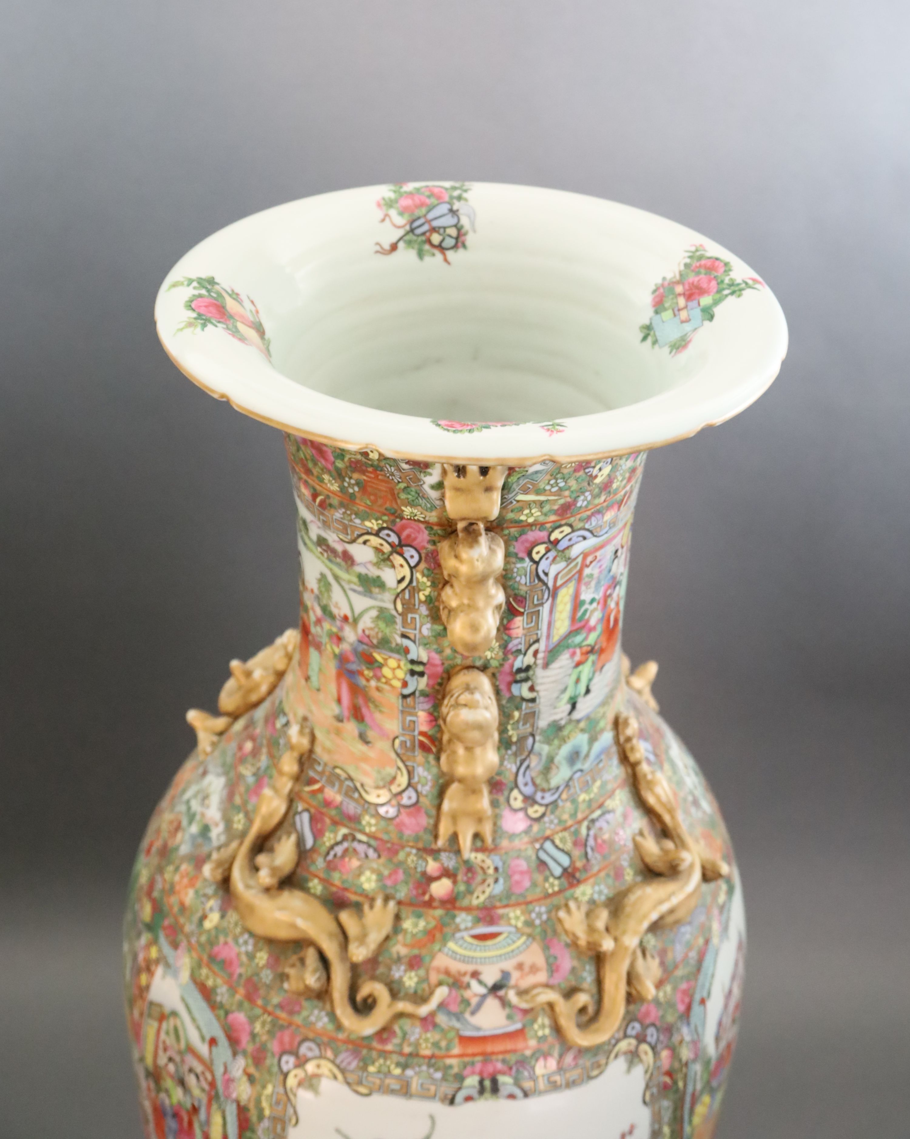 A pair of massive Chinese Canton style famille rose vases, 20th century and a pair of Chinese hongmu and marble stands, late 19th century